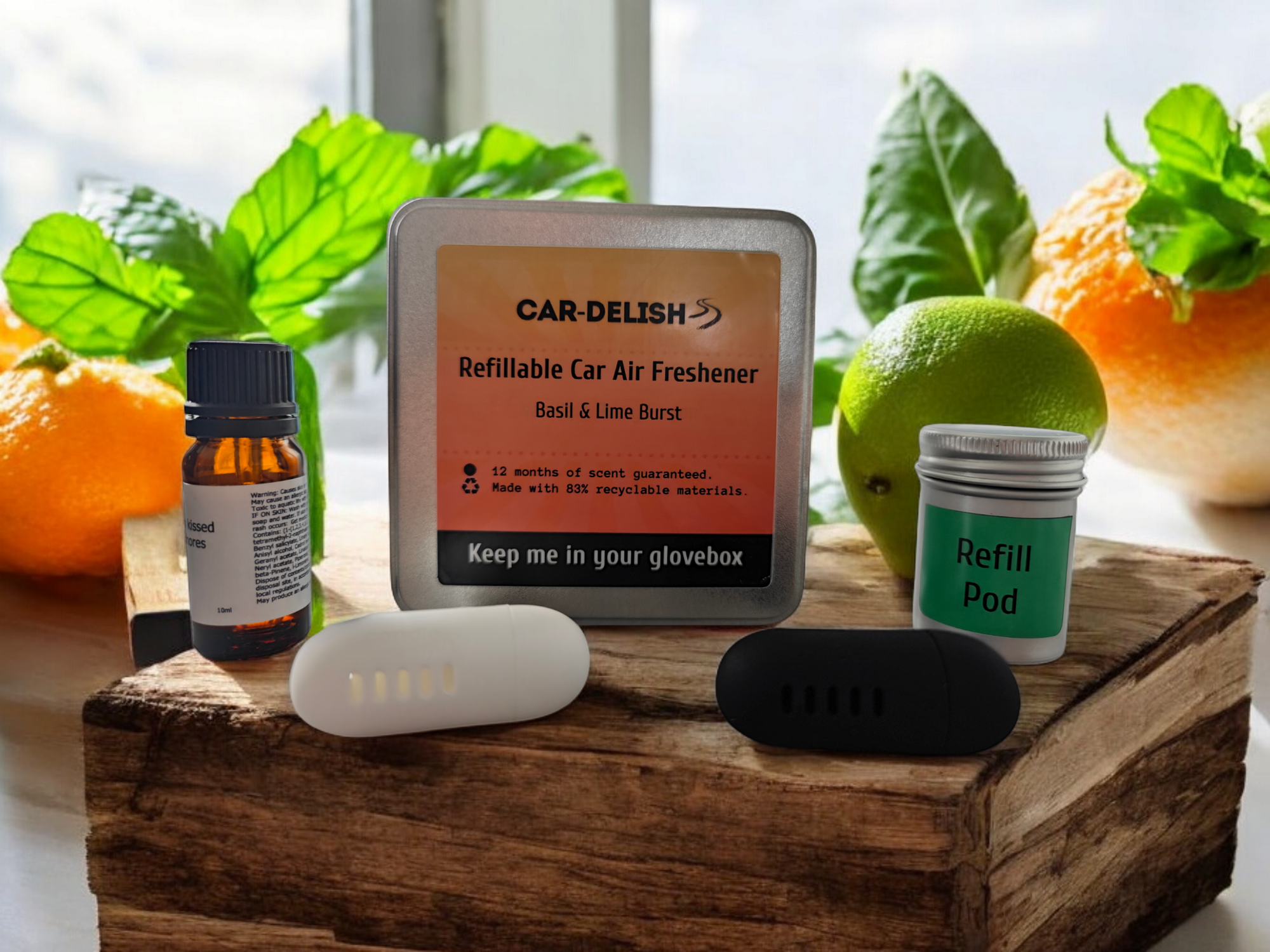 A picture showing the Car Delish Packaging Tin, colour options of the air freshener, the bottle of top of scent and the refill tin.