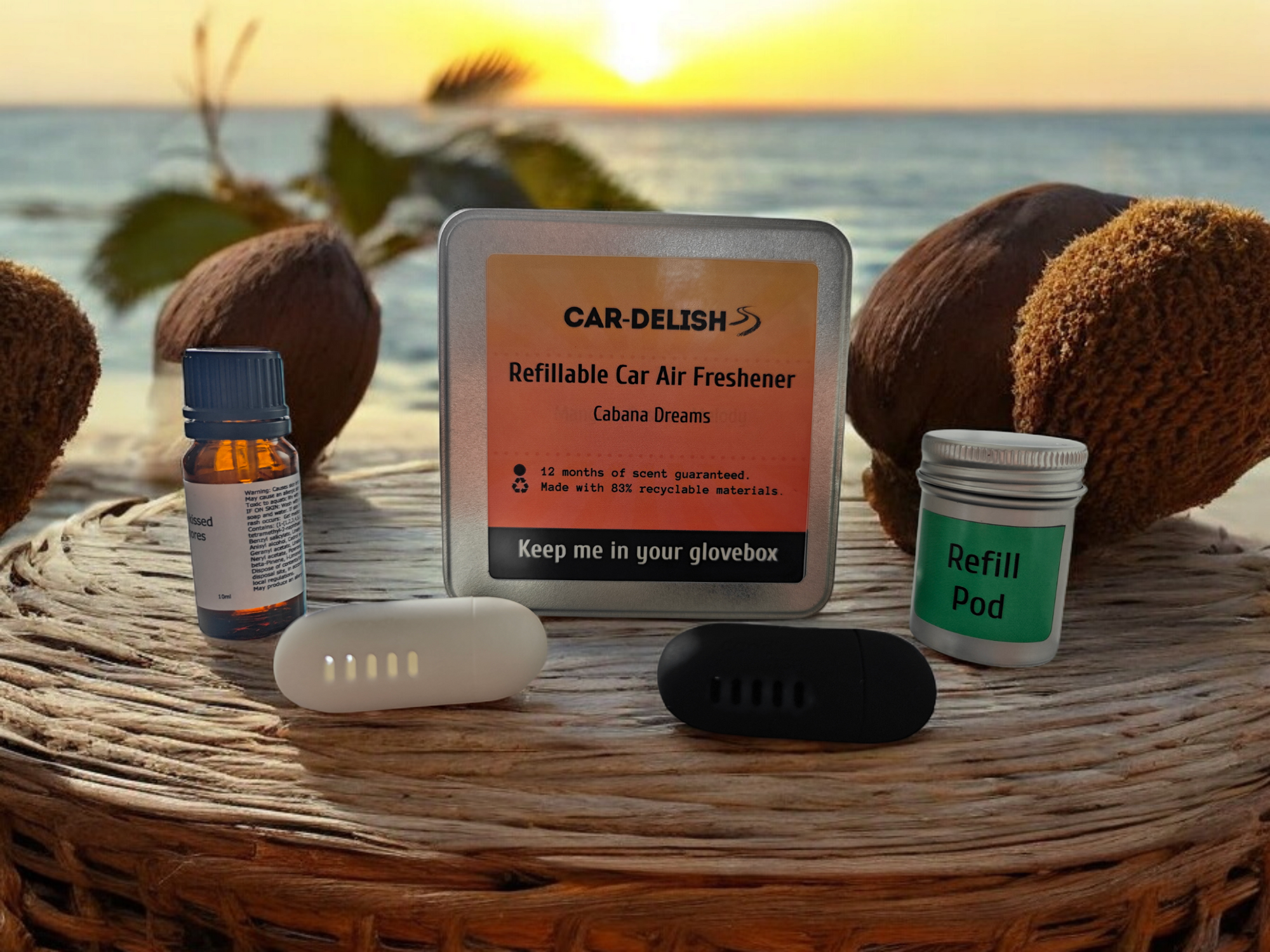 A picture showing the Car Delish Packaging Tin, colour options of the air freshener, the bottle of top of scent and the refill tin for the cabana dreams scent option
